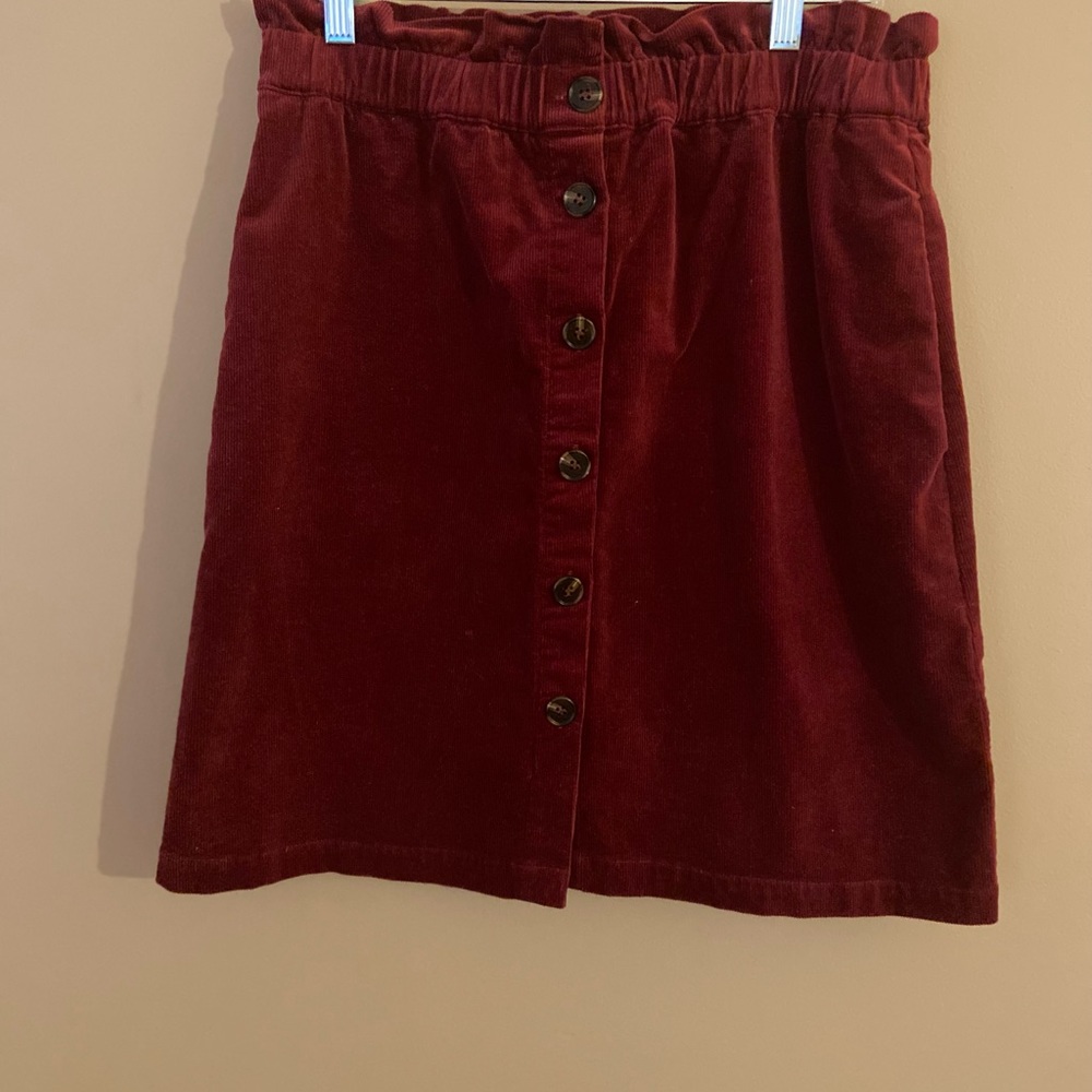 Knee length corduroy skirt.  Elastic waist with button front.